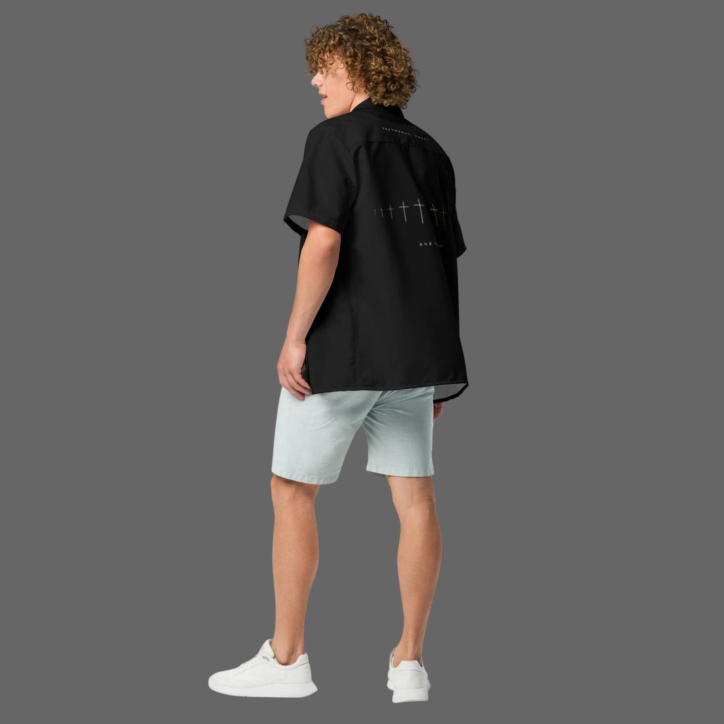 Back view of man wearing Truth Matters Hebrews 13:8 Yesterday Today and Forever button shirt in black