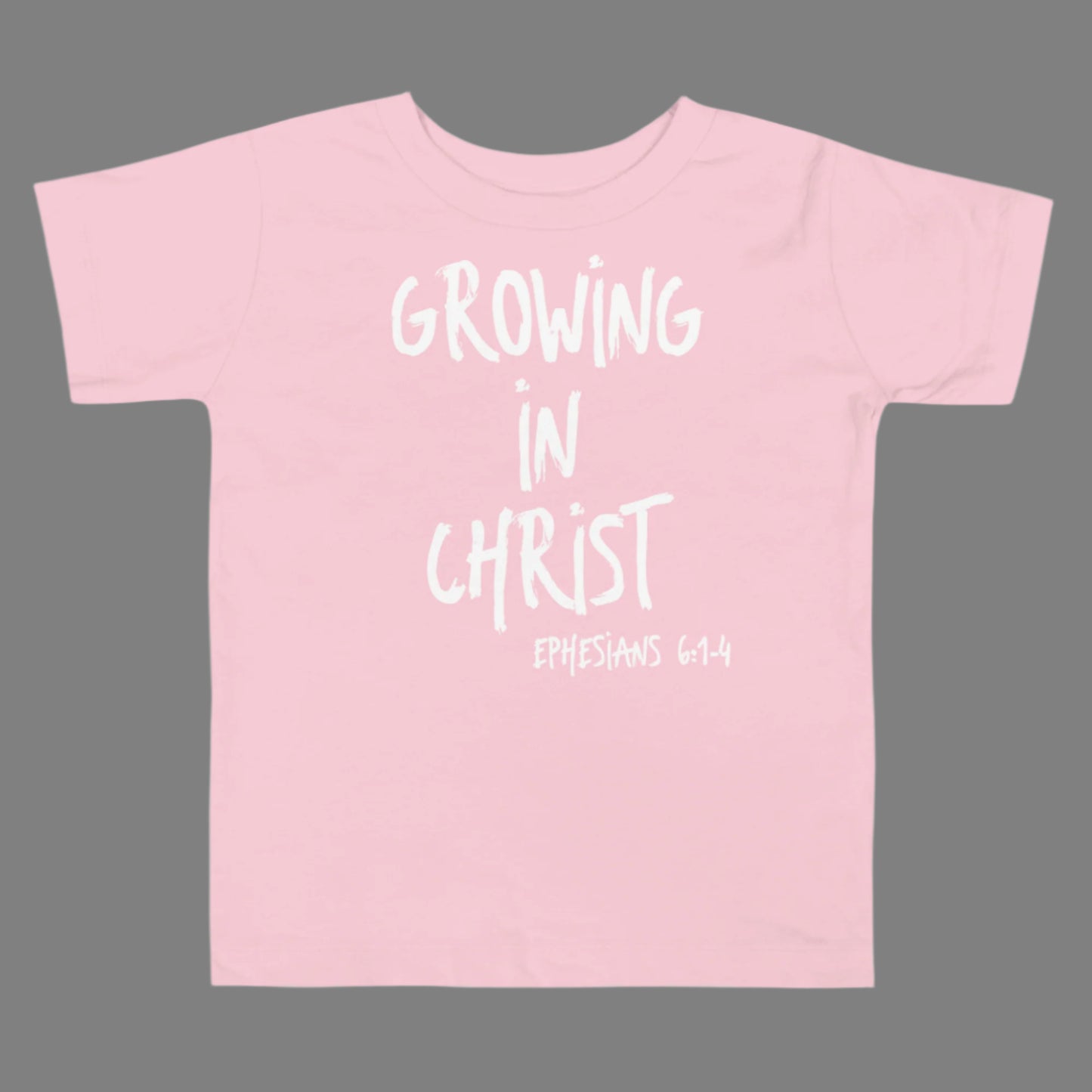 Truth Matters’ kids’ Ephesians 6:1-4 T-Shirt front with ‘Growing in Christ’ and scripture on soft cotton in pink.