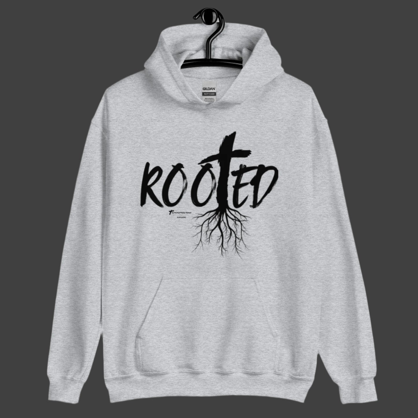 Front view of Truth Matters’ Rooted Hoodie with a cross and tree roots in ‘ROOTED’ on soft cotton-poly blend in sport grey.