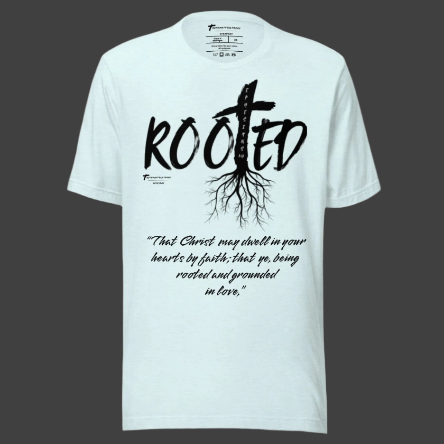 Truth Matters’ Rooted T-Shirt front with cross in ‘ROOTED’ and Ephesians 3:17 KJV on soft cotton in heather ice blue.