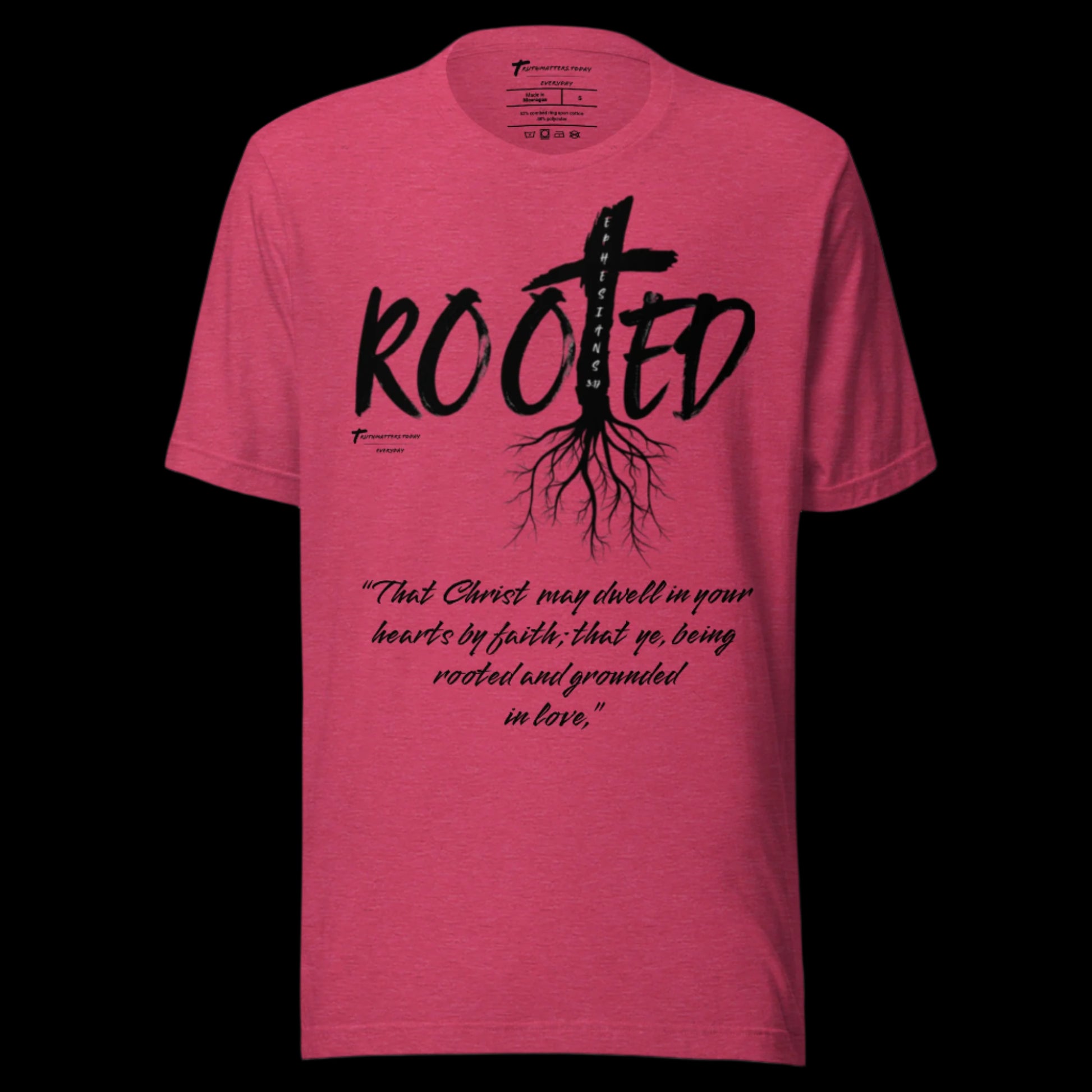 Truth Matters’ Rooted T-Shirt front with cross in ‘ROOTED’ and Ephesians 3:17 KJV on soft cotton in heather raspberry.