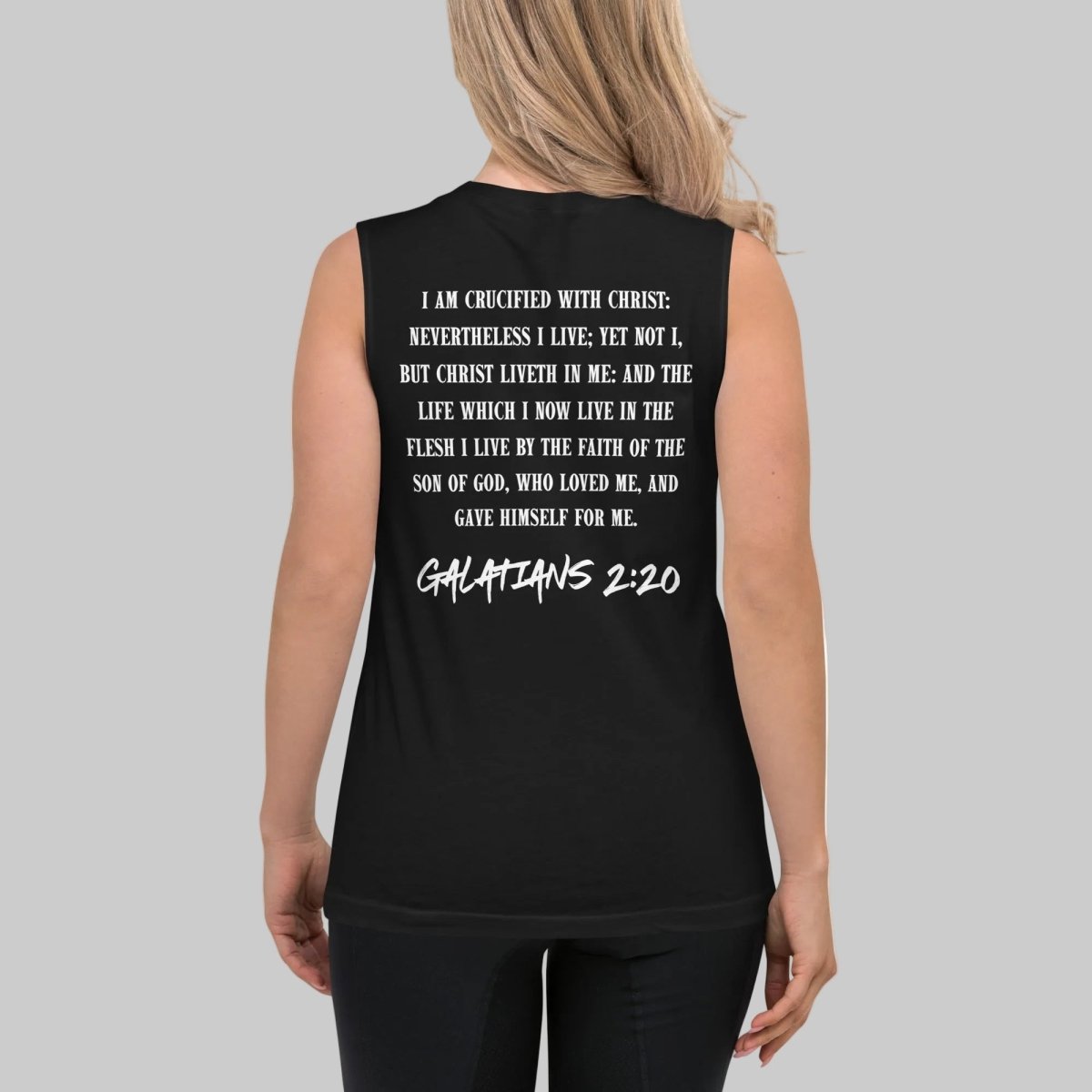 Woman wearing black sleeveless tank top with full Galatians 2:20 Bible verse printed on the back