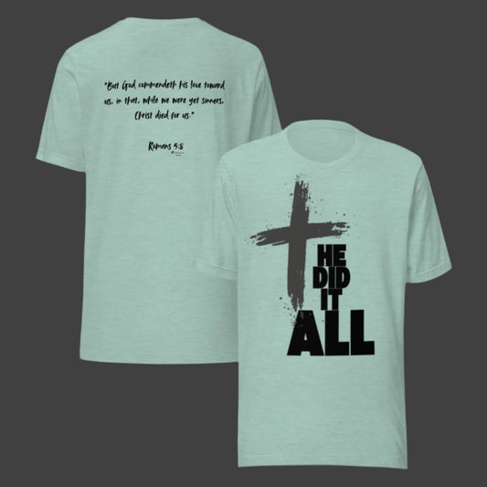 He Did It All Christian t-shirt in heather dusty blue green with cross design and Romans 5:8 on back.