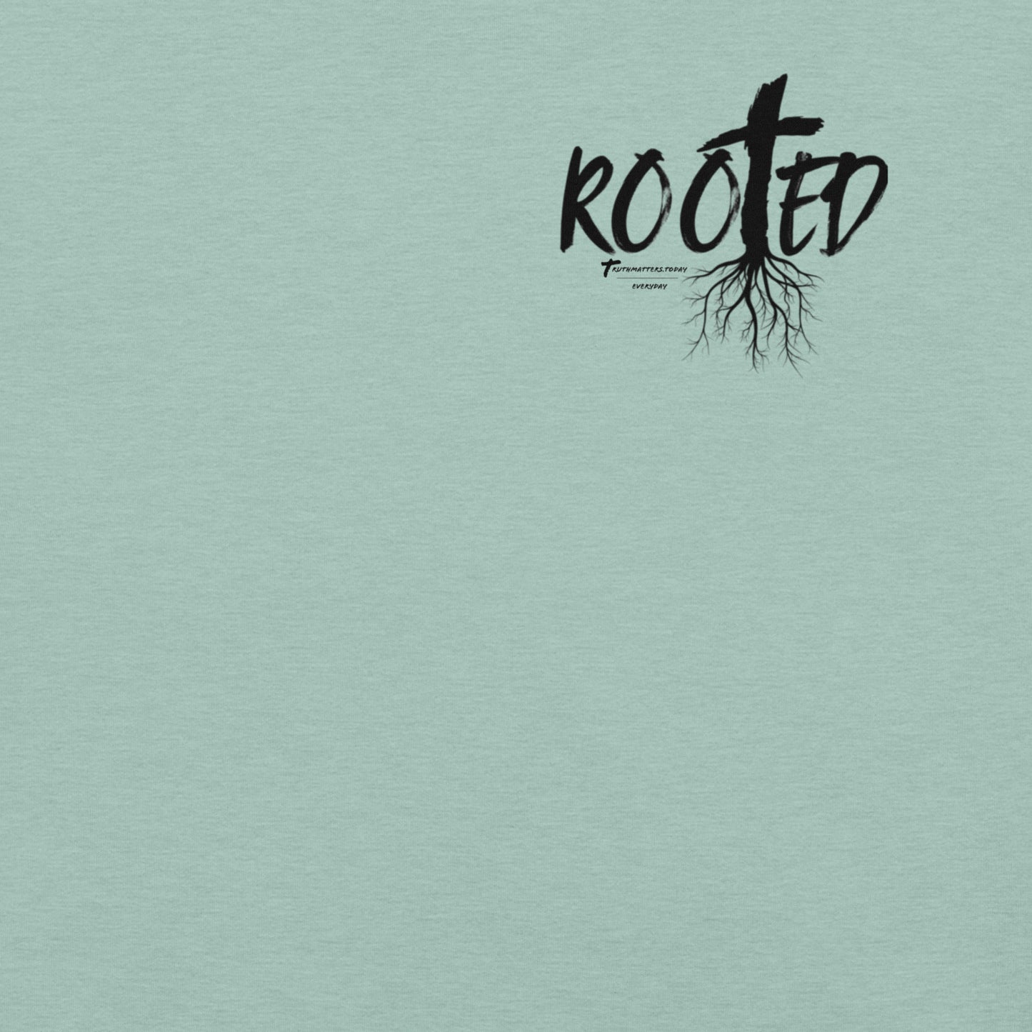 Front of Rooted Christian t-shirt in heather green blue with cross and tree roots design and Colossians 2:6-7 scripture.