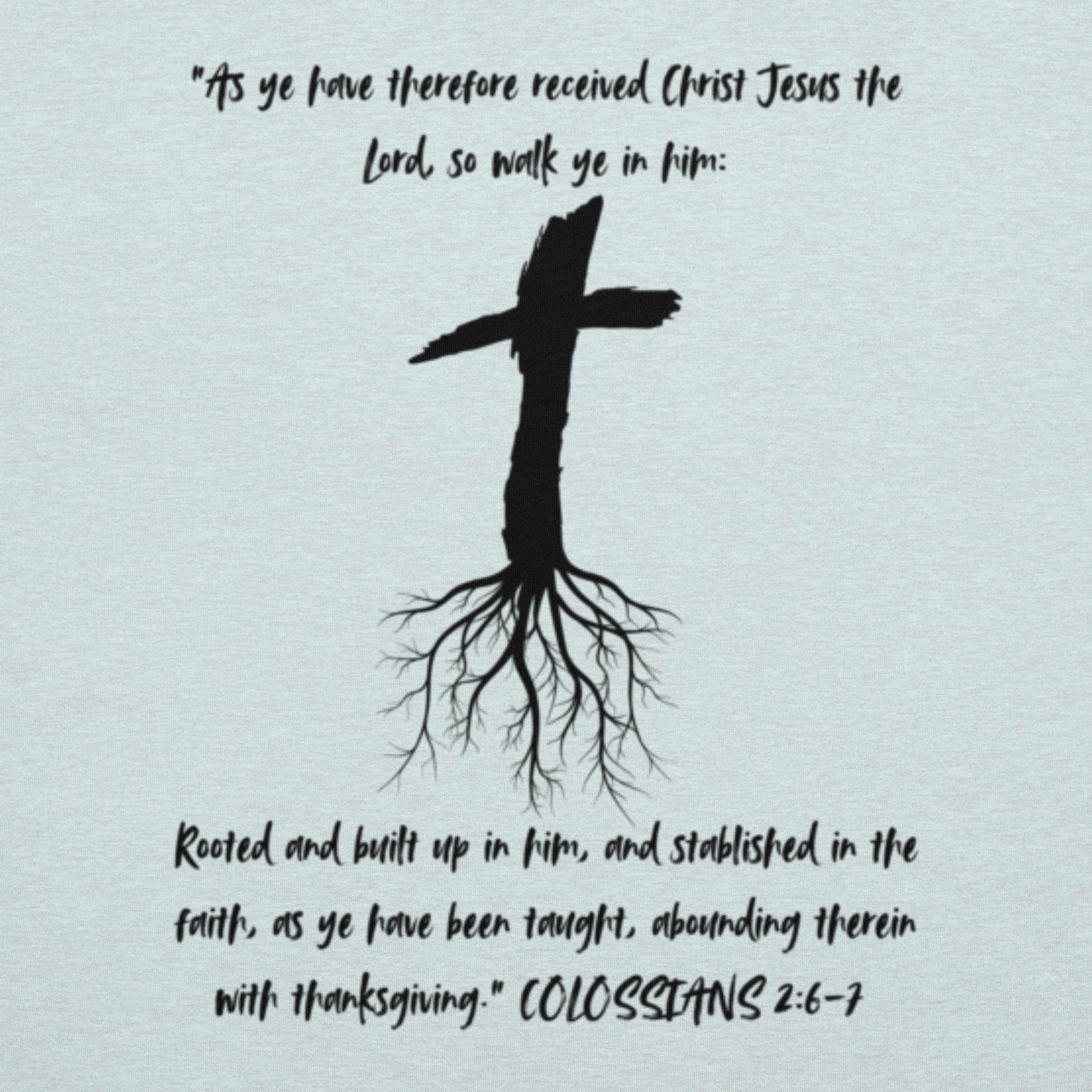 Rooted Christian t-shirt in heather ice blue with cross and tree roots design and Colossians 2:6-7 scripture.