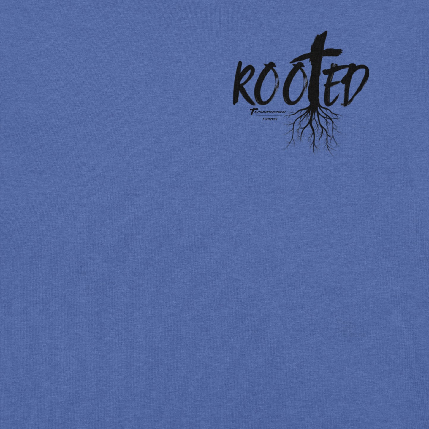 Front of Rooted Christian t-shirt in heather true royal with cross and tree roots design and Colossians 2:6-7 scripture.