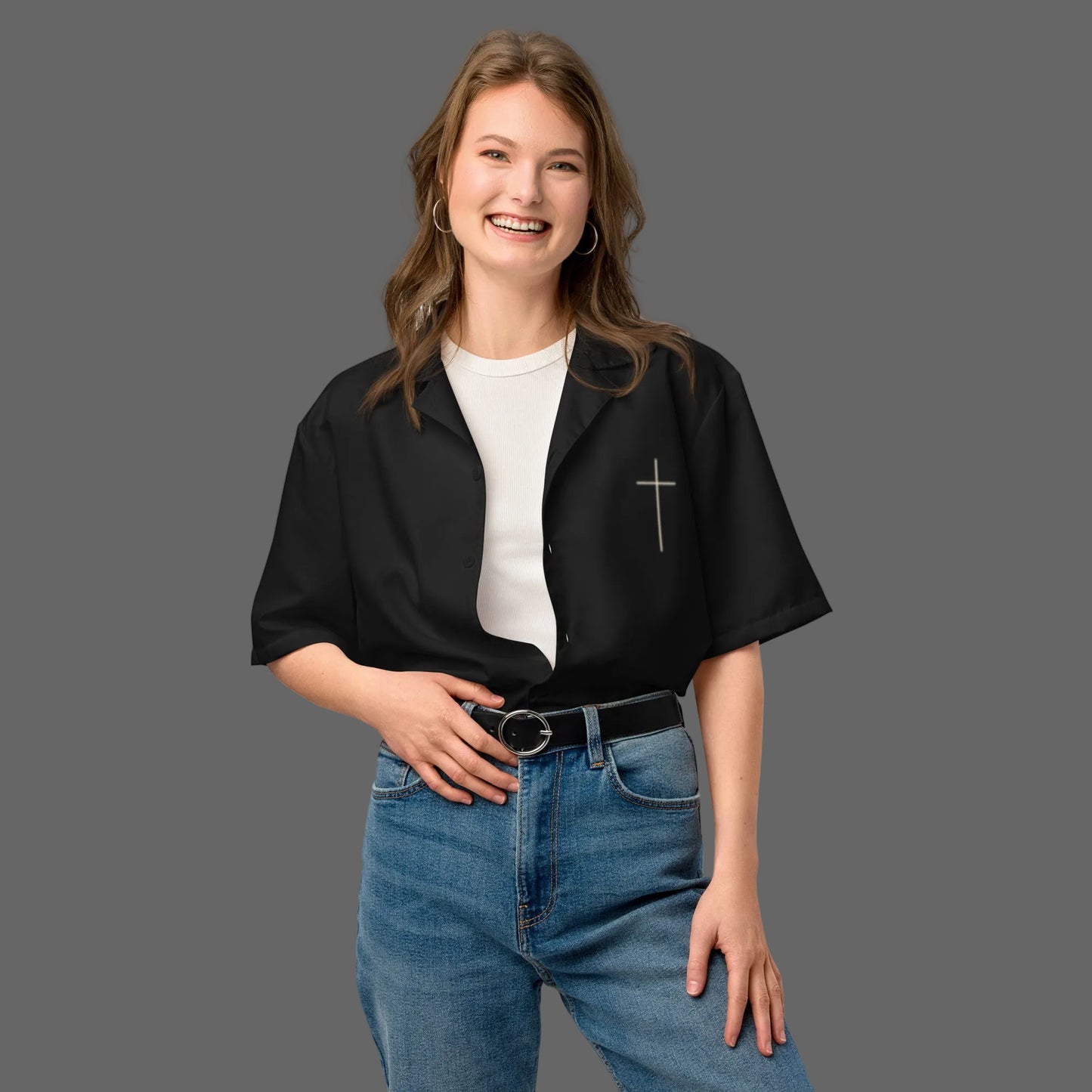 Woman wearing Truth Matters Hebrews 13:8 button shirt in black open over a white tee, styled with jeans