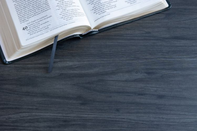 Open Bible on a dark wooden surface Truth Matters Today