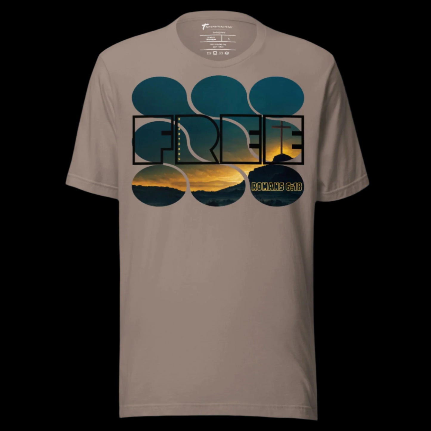 Truth Matters’ Romans 6:18 T-Shirt front with ‘FREE’, ‘Righteous’, and sunset cross on soft cotton in Pebble.