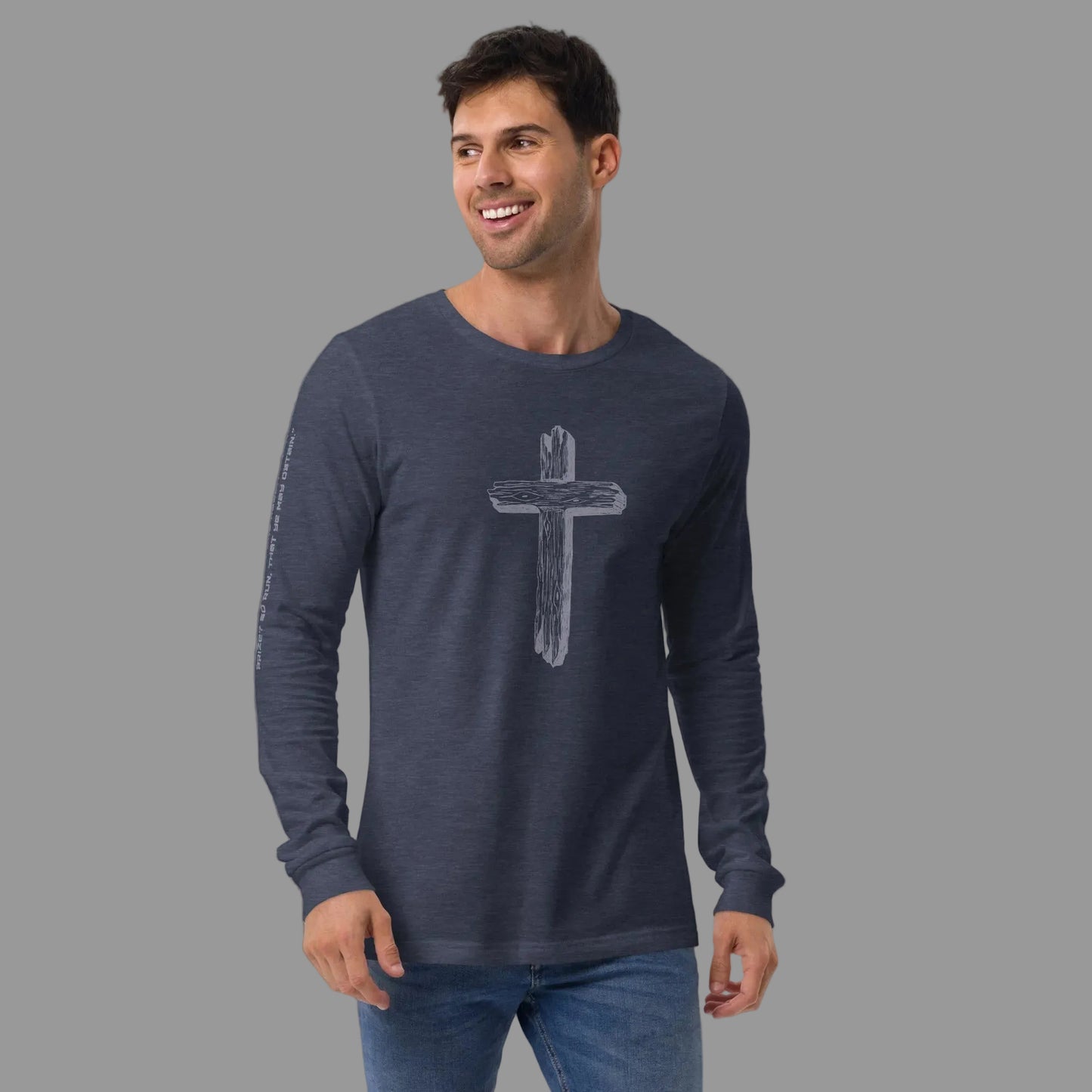 Man wearing Truth Matters Run the Race 1 Corinthians 9:24 long sleeve tee in Heather Navy, weathered wooden cross on front