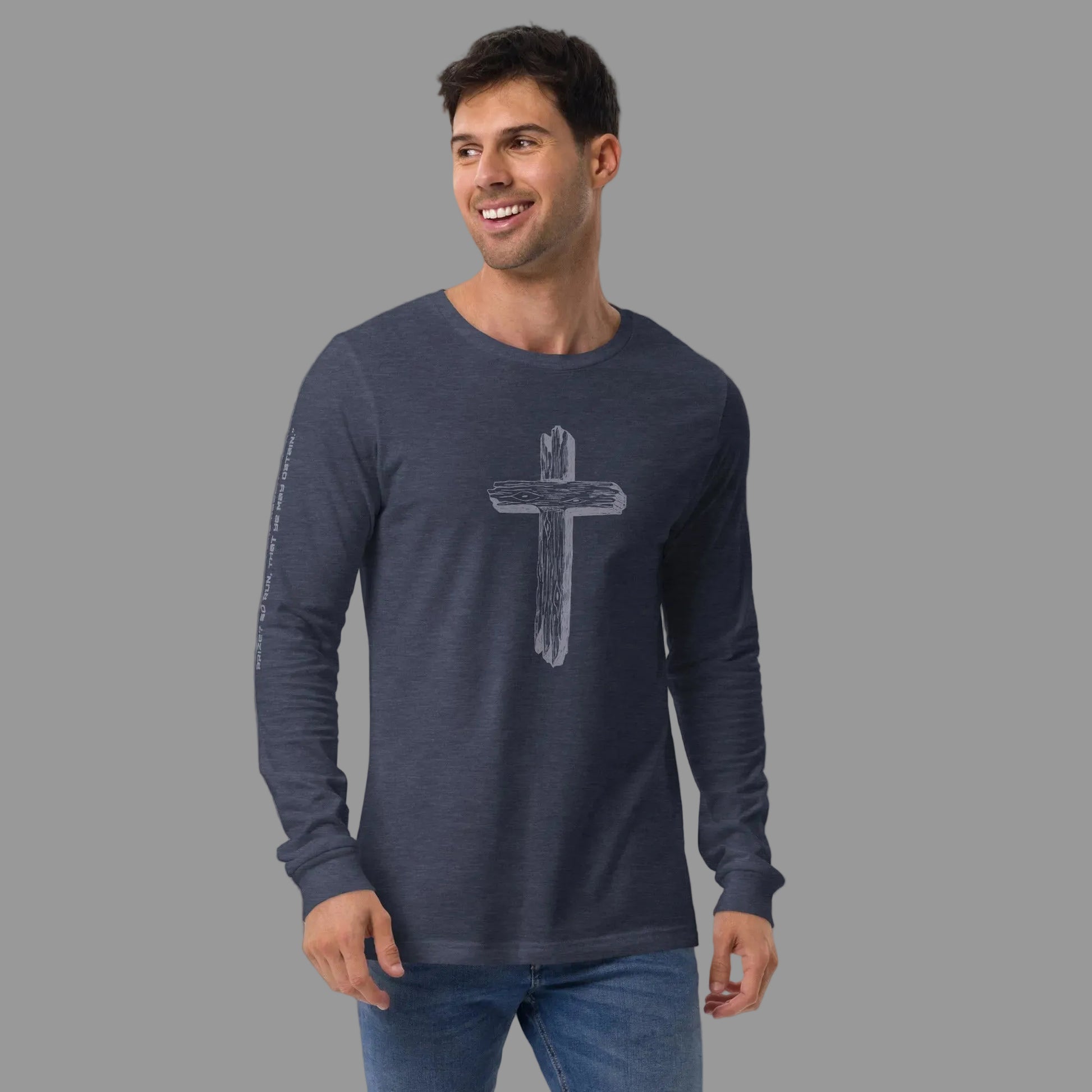 Man wearing Truth Matters Run the Race 1 Corinthians 9:24 long sleeve tee in Heather Navy, weathered wooden cross on front