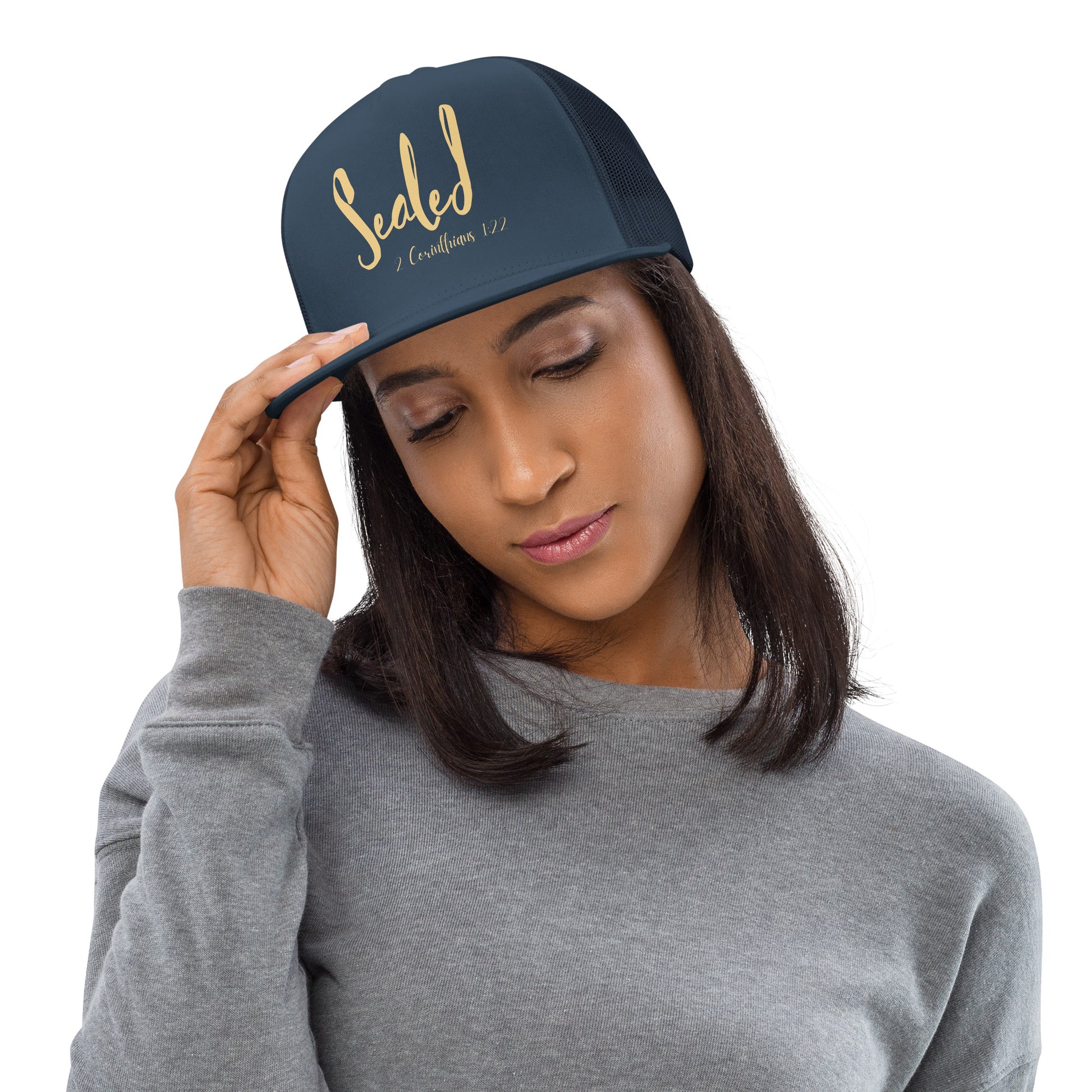 Truth Matters’ 2 Corinthians 1:22 Breathable Trucker Cap with ‘Sealed’ on mixed fabric.