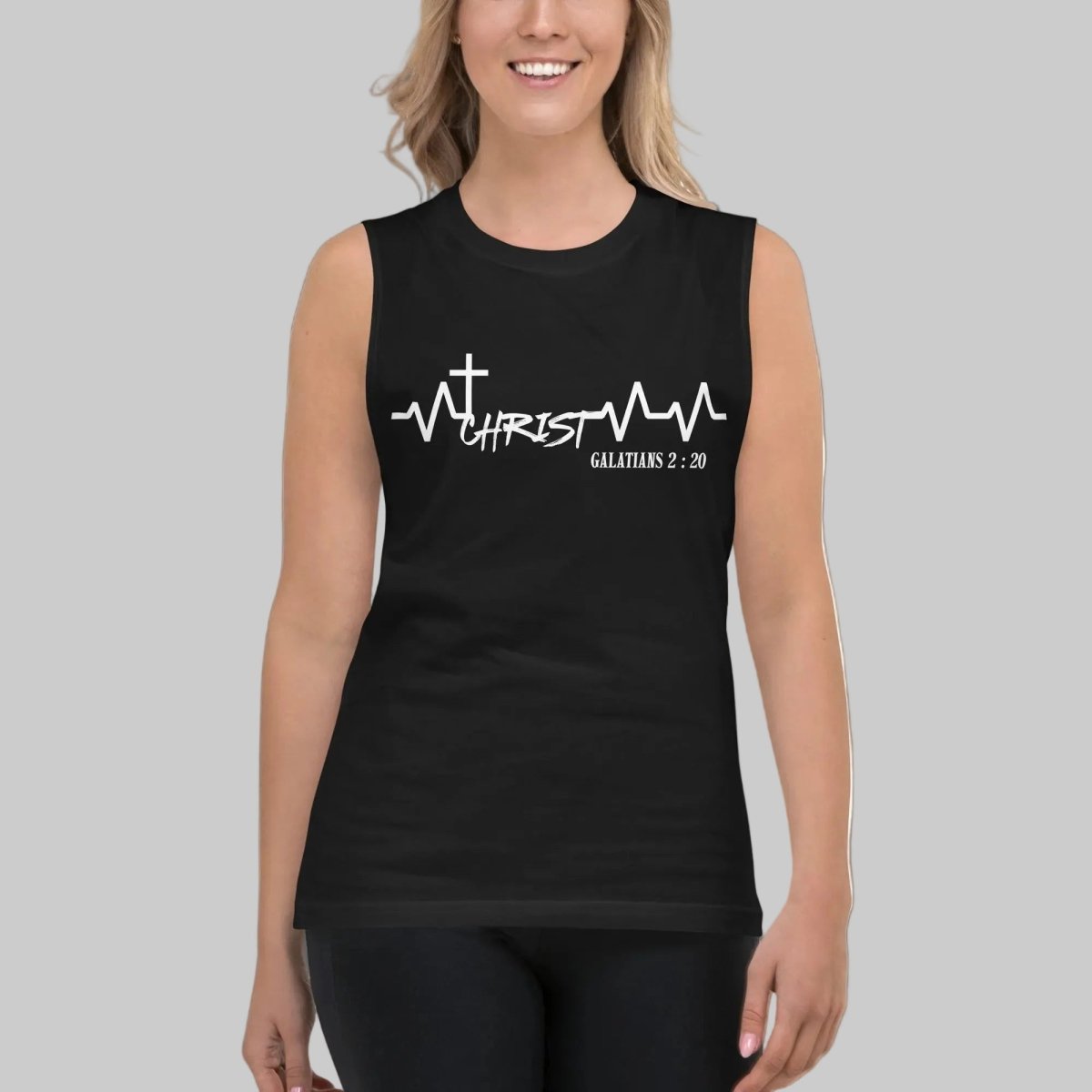 Woman wearing black Galatians 2:20 Christ heartbeat Christian tank top with cross and ECG heartbeat line design on the chest