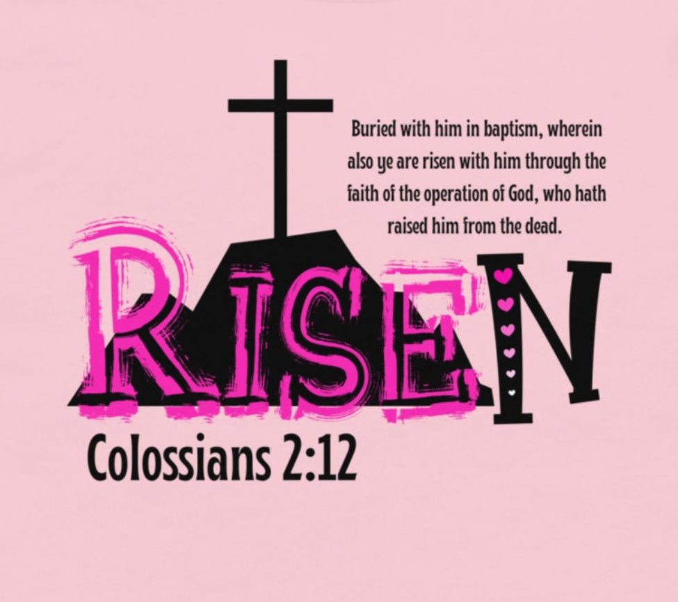 close up of pre-shrunk Colossians 2:12 RISEN toddler tee, mountain cross backdrop Bible verse toddler tee in pink