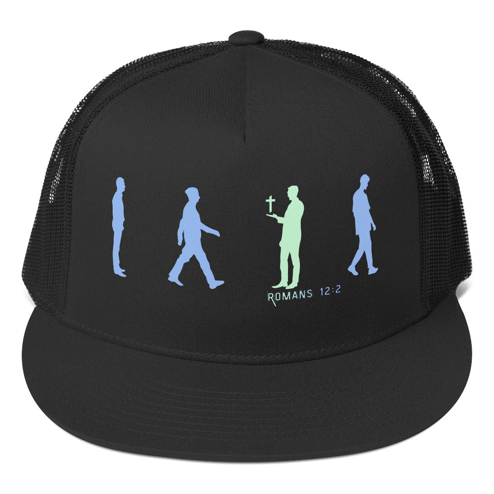 Close-up print detail of Romans 12:2 silhouettes—one holding cross, symbolizing transformation and renewed mind on faith hat